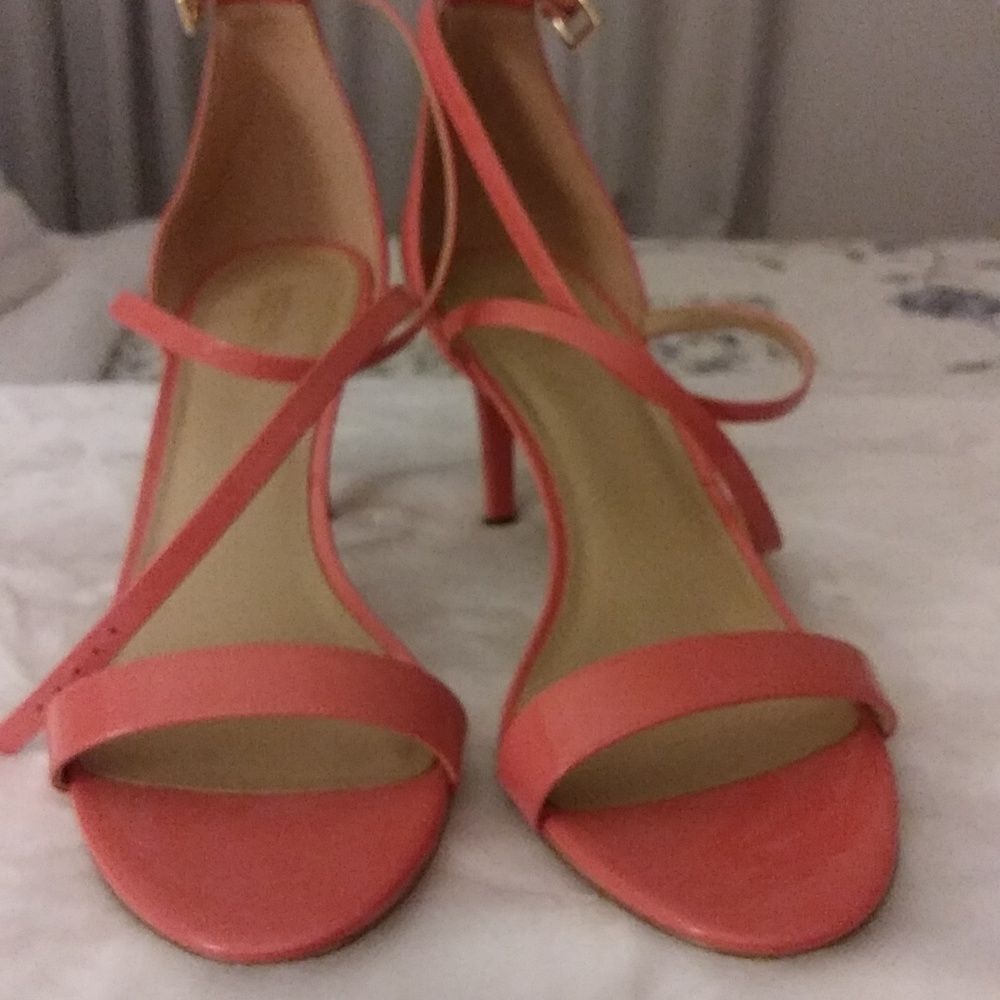 It's size 11 Michael Kors pair of shoe, orangish in color, and beautiful.